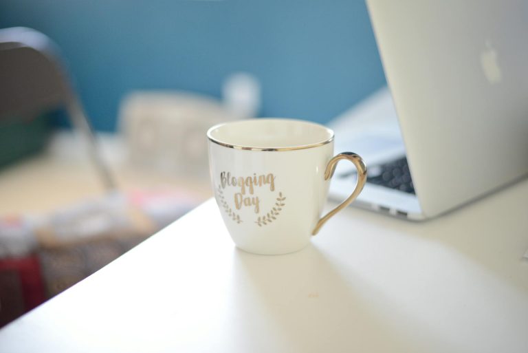 close up shot of a white ceramic cup on white surface